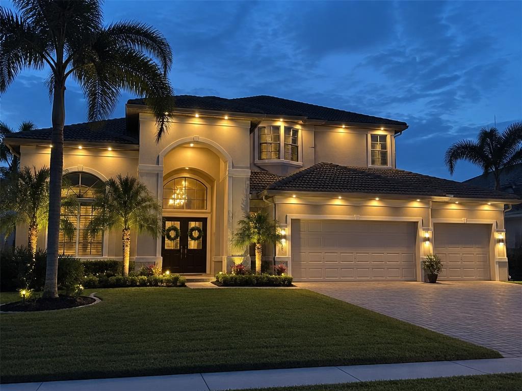 Two-story Florida home with discreet warm-white permanent LED lighting along the roofline at dusk